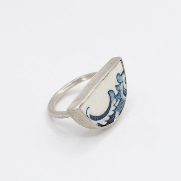 Half round ring with blue and white antique ceramic set in silver