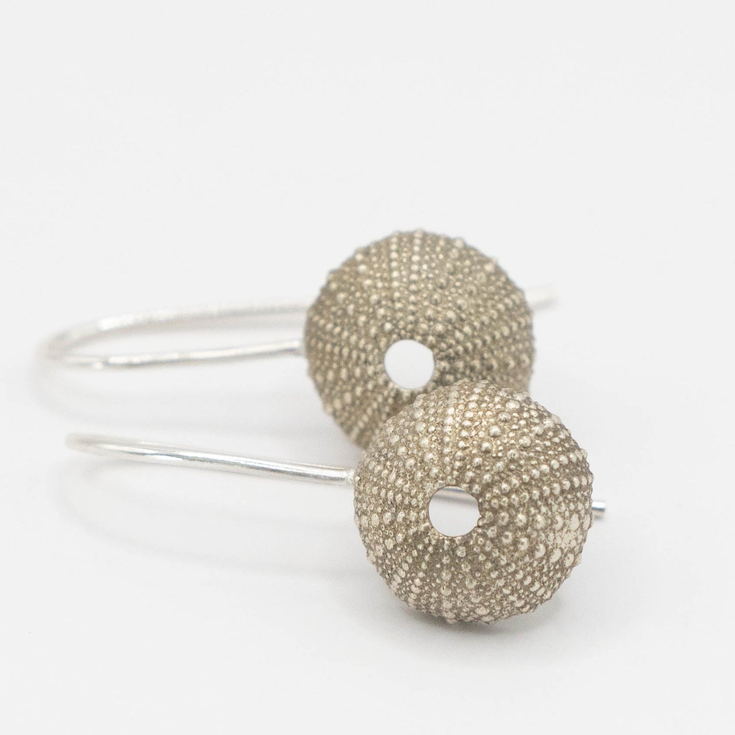Sea Urchin Hook Earrings - low angle close up texture sterling silver hand cast earrings