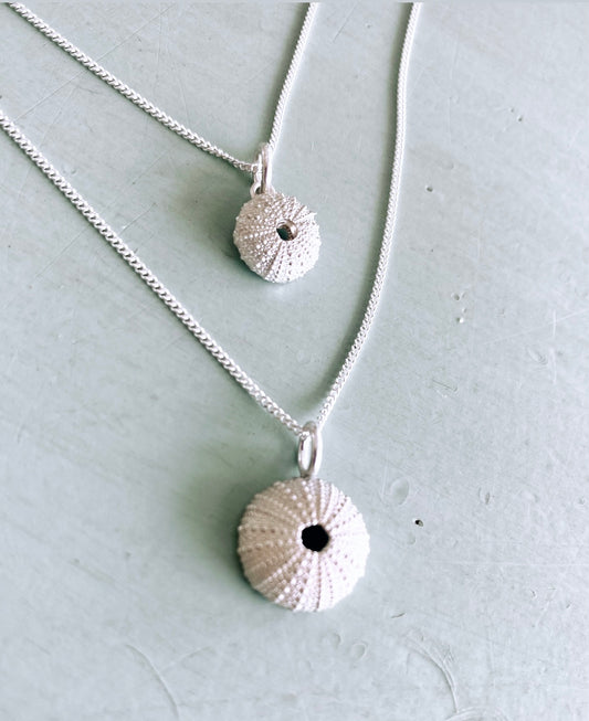 Handcrafted sterling silver sea urchin pendant necklace on a delicate chain