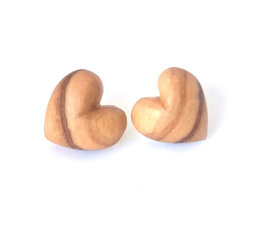 Olive wood heart stud earrings showcasing smooth, natural grain on a clean white backdrop.