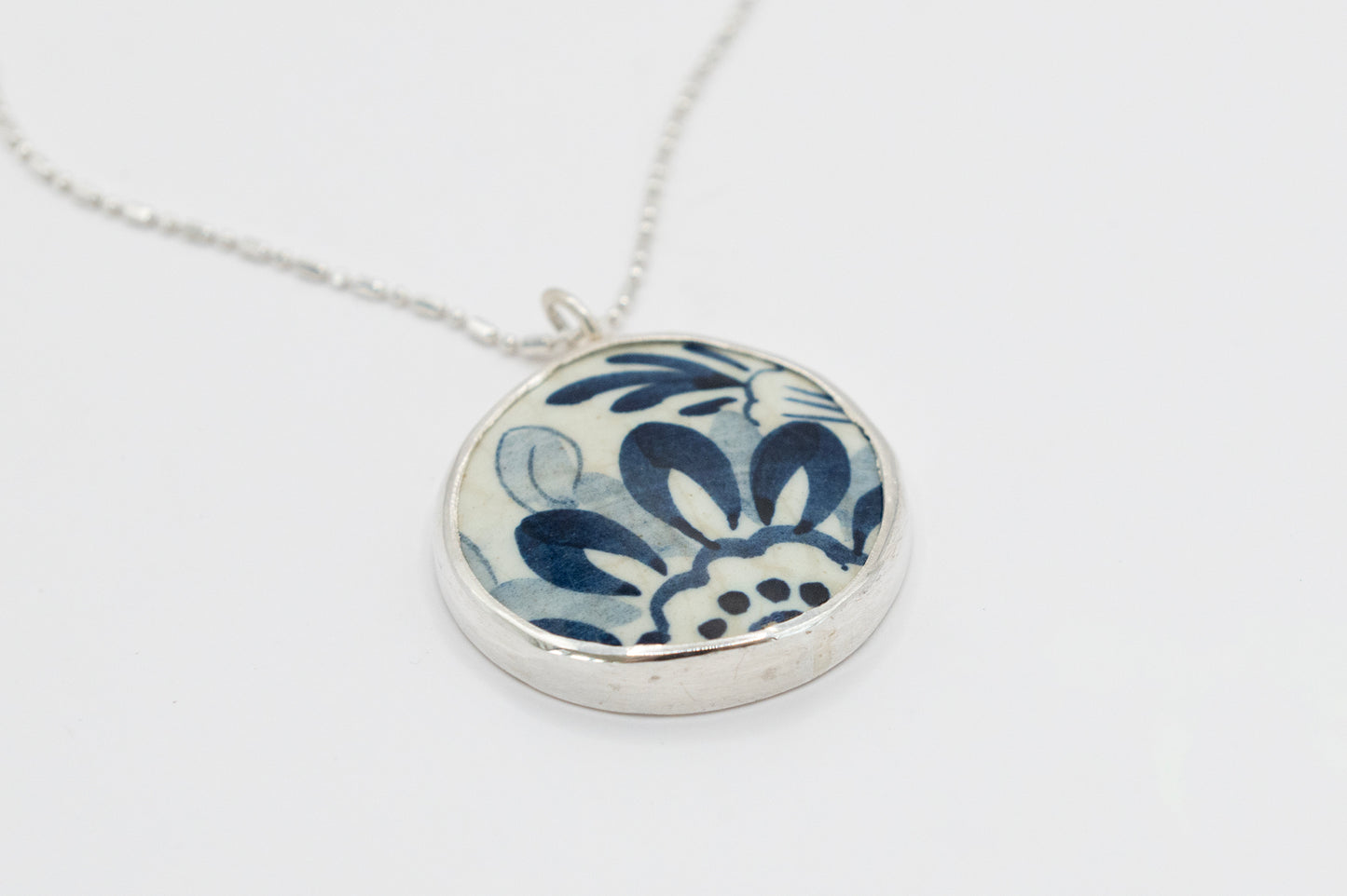 Beautiful blue and white broken China ceramic and silver pendant