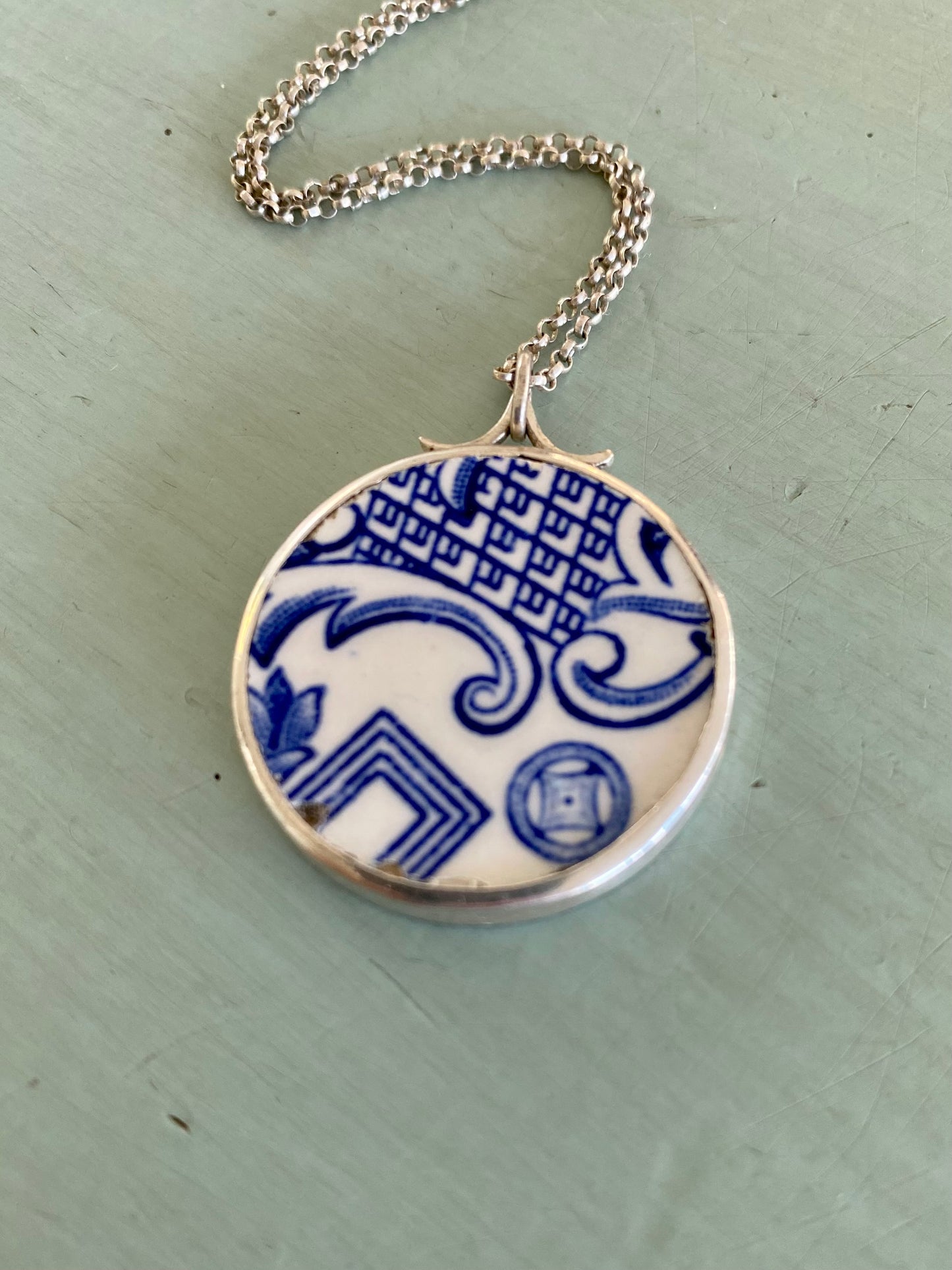 Handcrafted Willow Pattern Ceramic Pendant in Sterling Silver Chain - Front View.