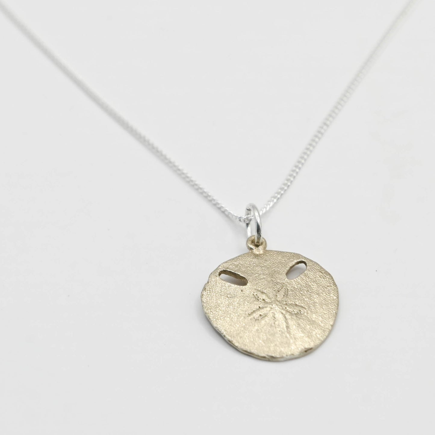 Small Pansy Shell Pendant - front centred view, solid brass with sterling silver curb chain