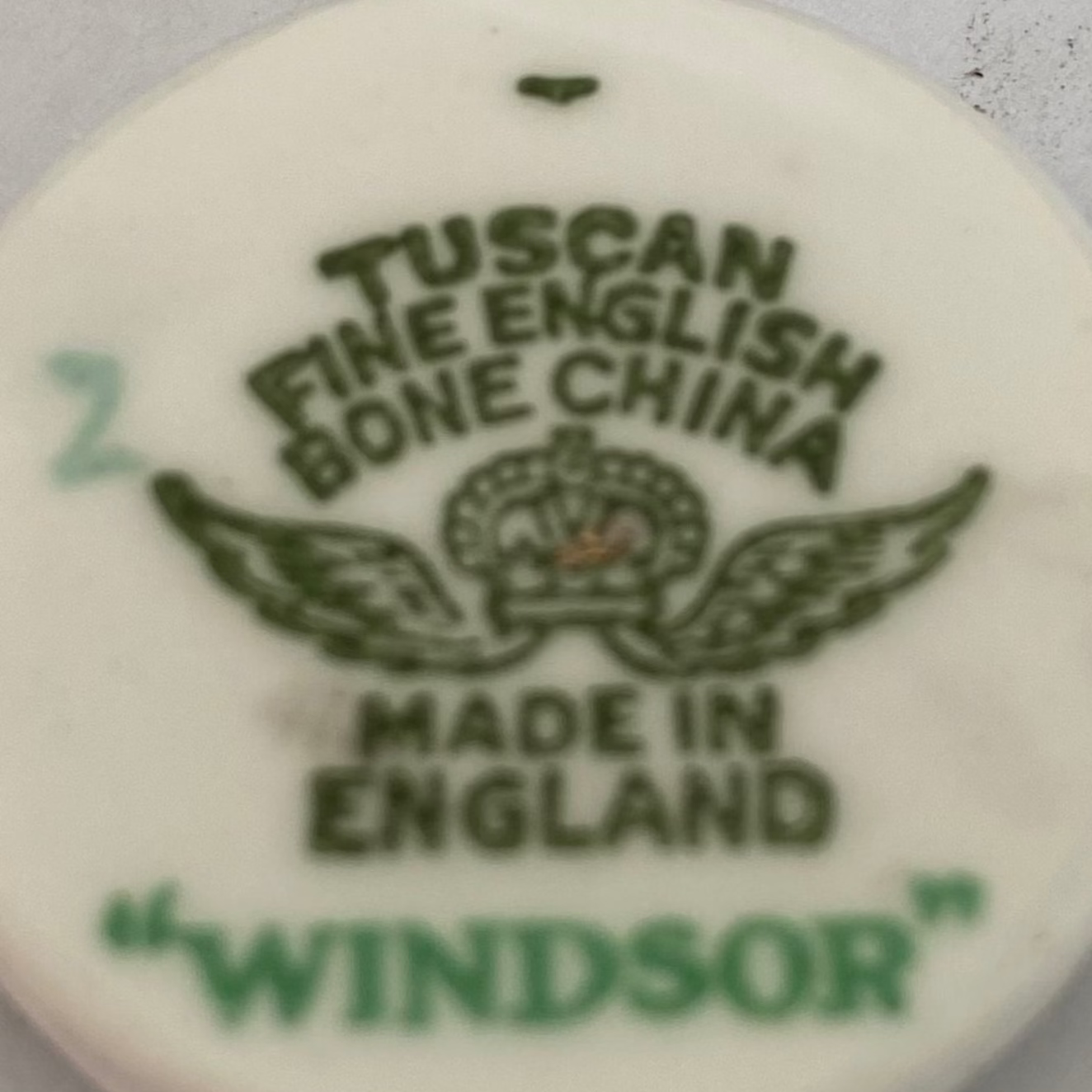 Tuscan Fine English Bone China branding on a product label.