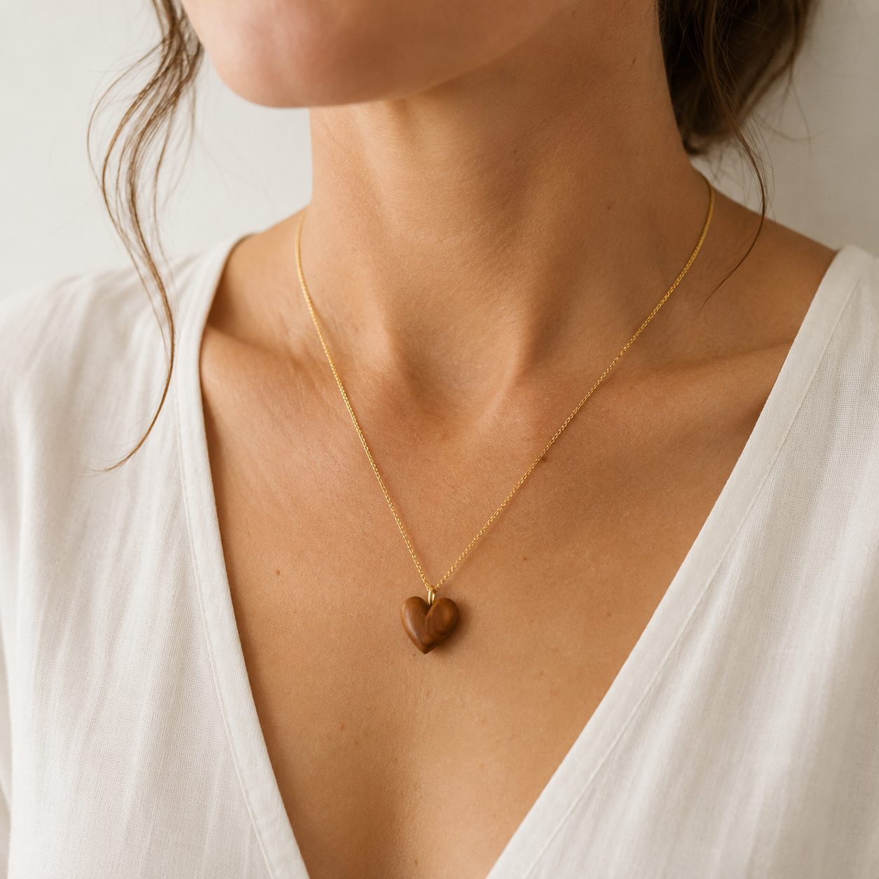 Hand carved olive wood heart pendant