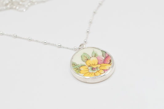 Antique Ceramic floral design and silver pendant