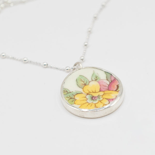 Antique Ceramic floral design and silver pendant