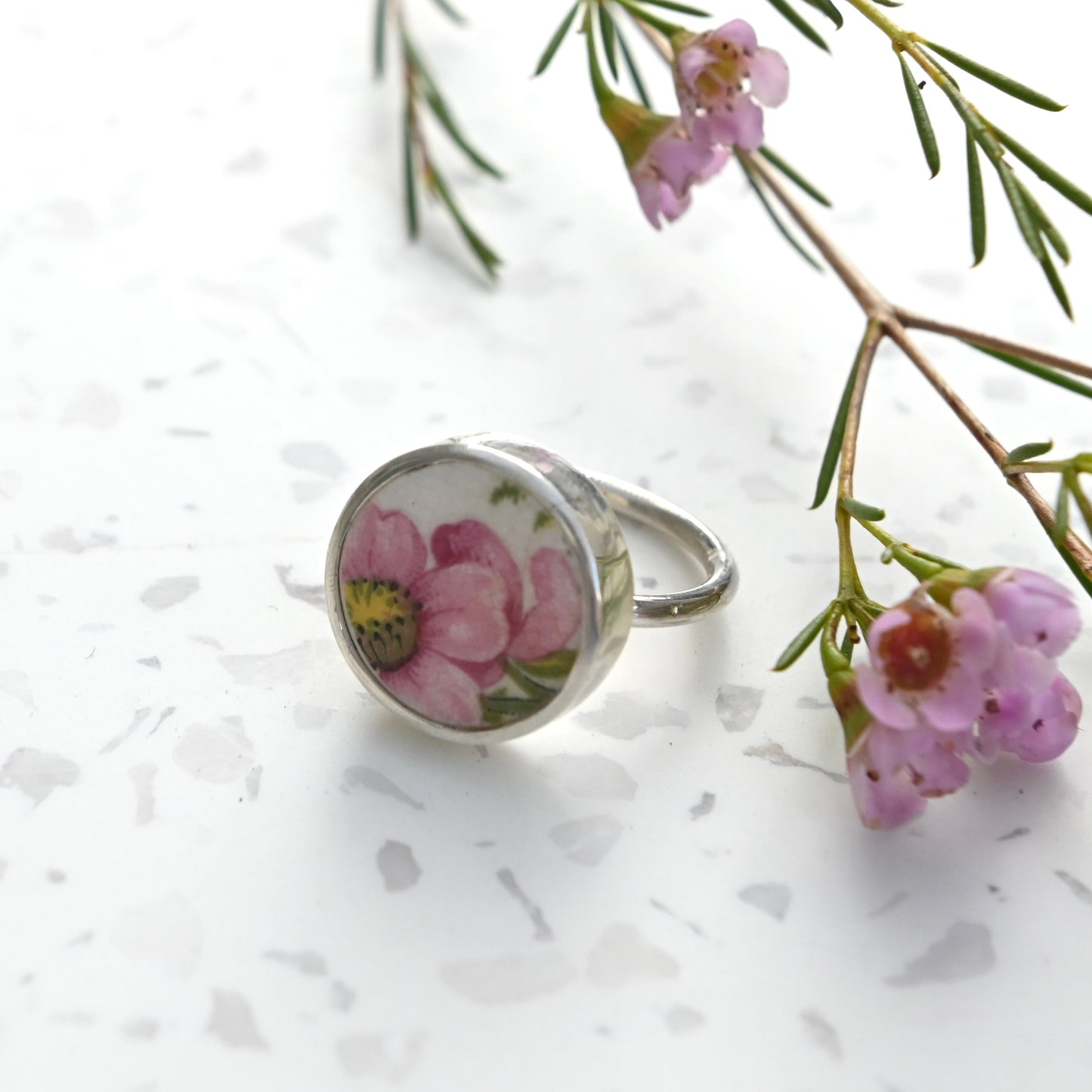 Pink bloom from broken China set in silver