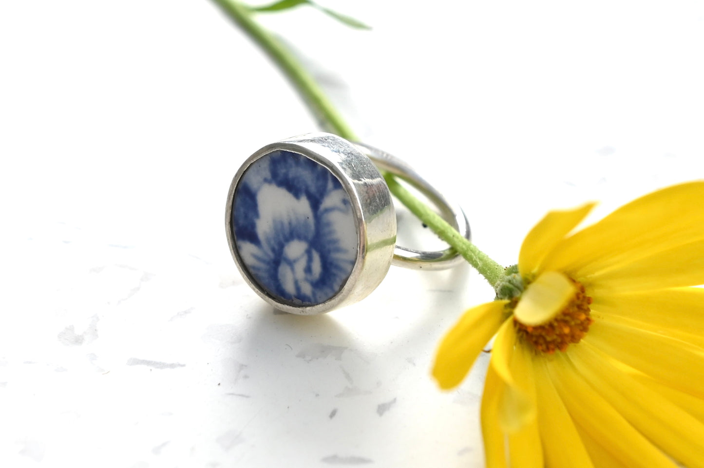 Blue and white ceramic ring set with sterling silver