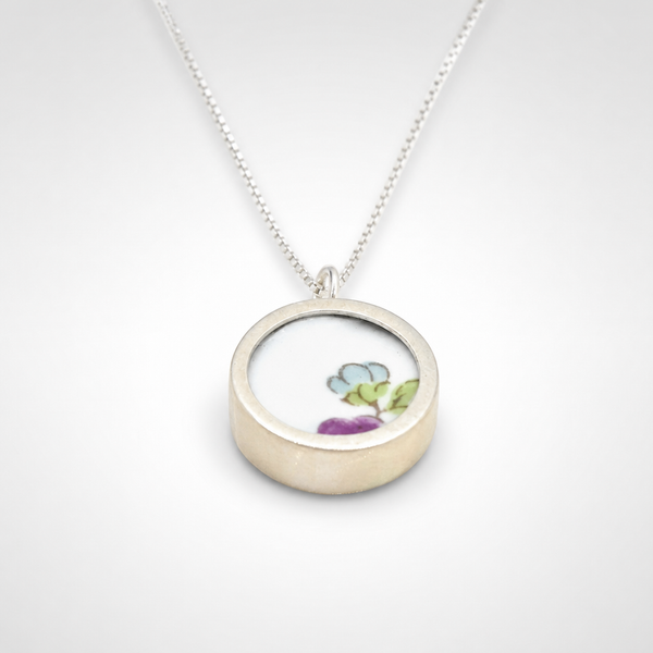 Double sided pendant made with broken china and sterling silver
