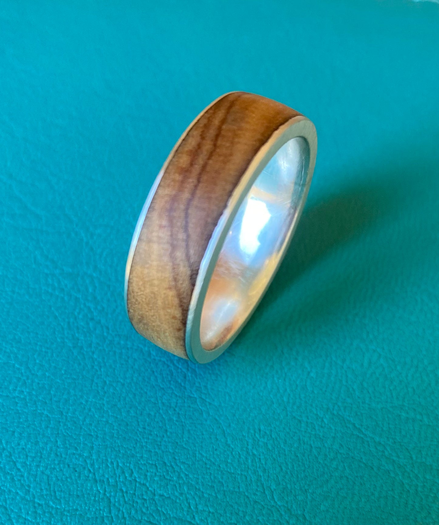 Olive wood with thin silver sides