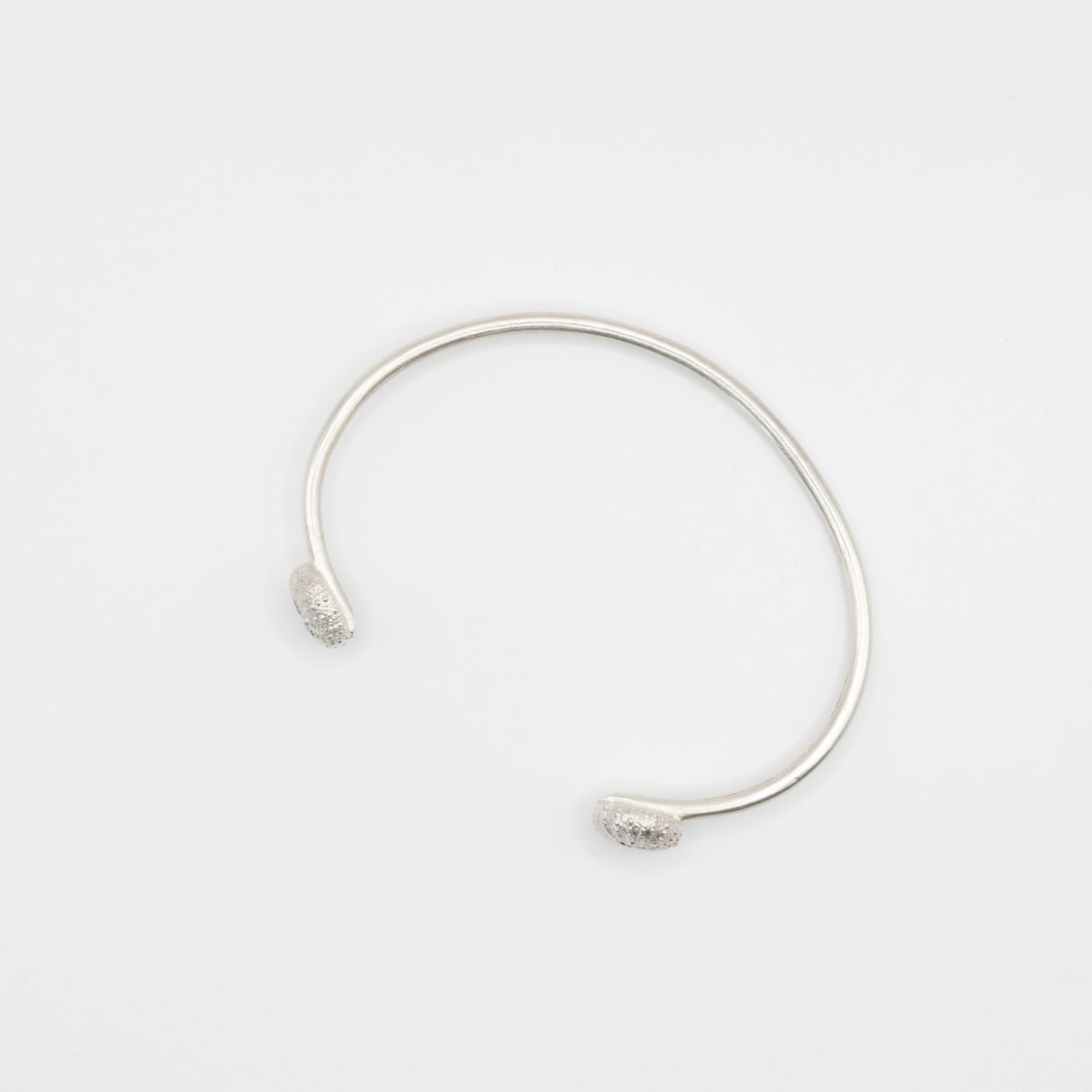 sterling silver sea urchin bangle with blue topaz top view