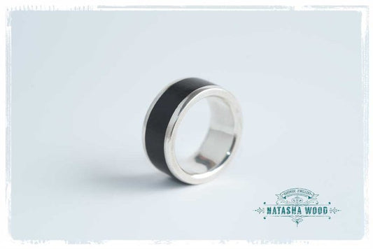Top view of men's African Blackwood and silver ring showcasing broad design and dark wood detail