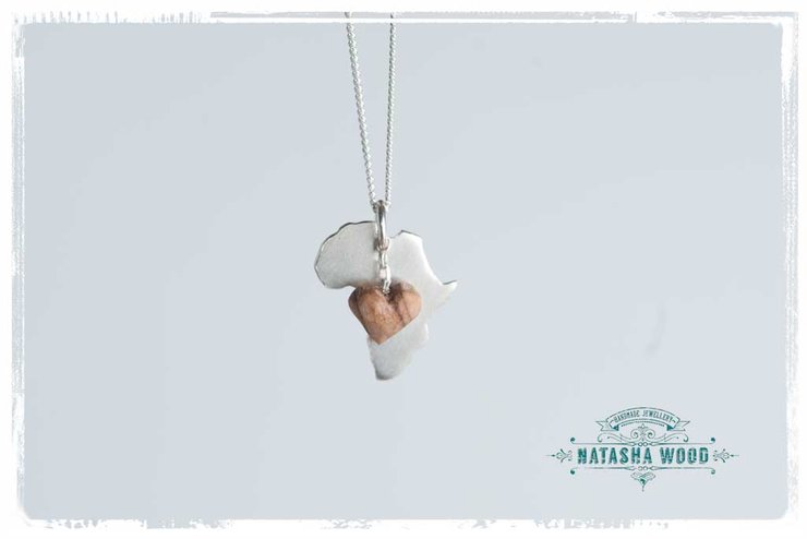 Silver Africa pendant with a wooden heart charm on a white background