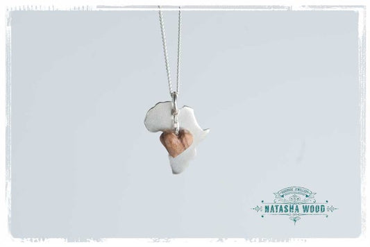 Silver Africa pendant with a wooden heart charm on a white background