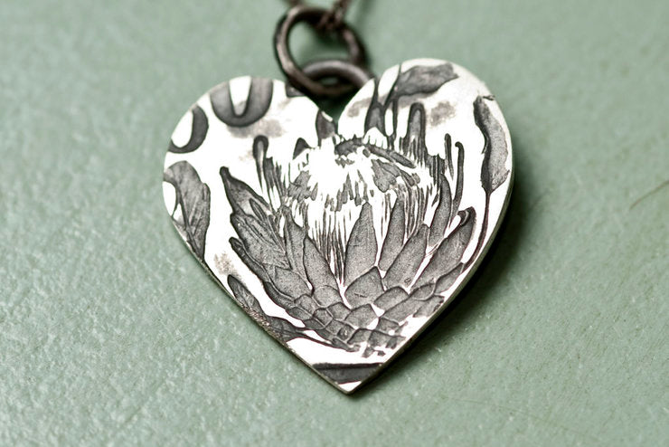 Elegant Protea Heart Pendant in oxidised sterling silver, worn on a 45cm chain