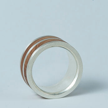 Inside view of the layered ring showing the comfort-fit design and wood detailing.