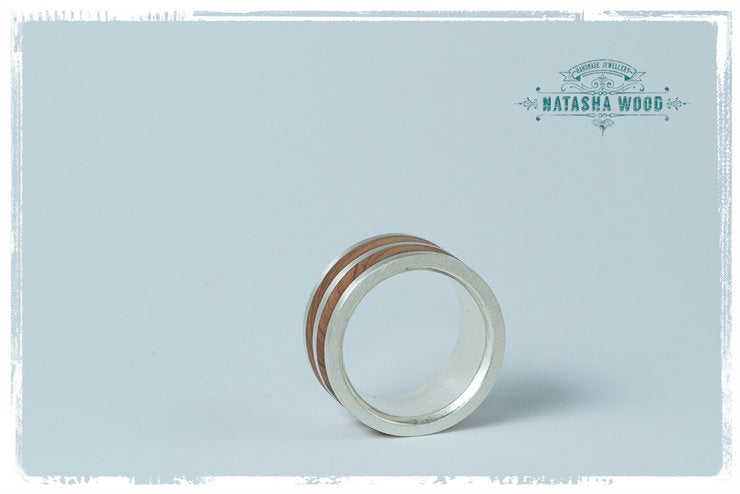 Inside view of the layered ring showing the comfort-fit design and wood detailing.