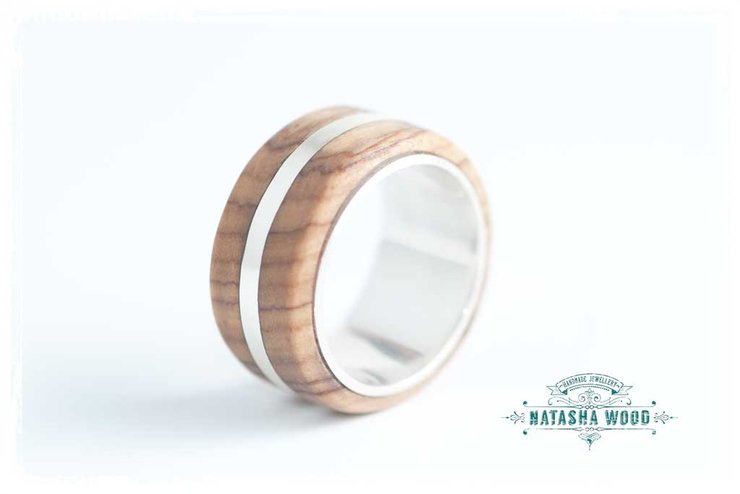 Angled side view of the olive wood inlay silver band highlighting the smooth layers.