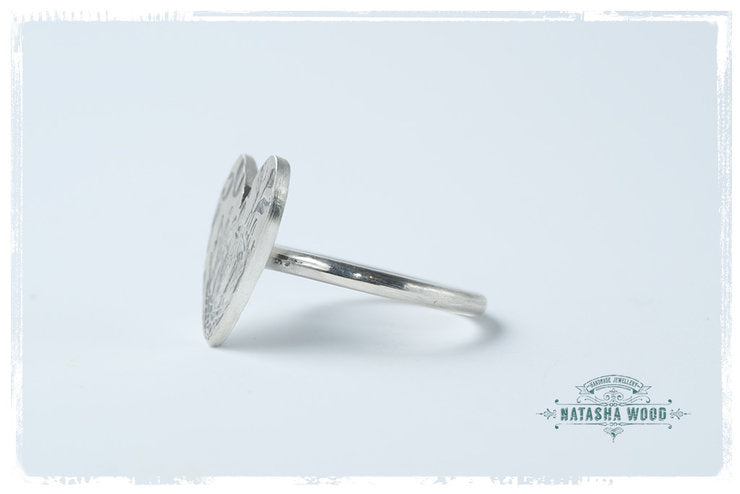 Side view of the Protea Heart Ring, focusing on the slender sterling silver band and its smooth finish.