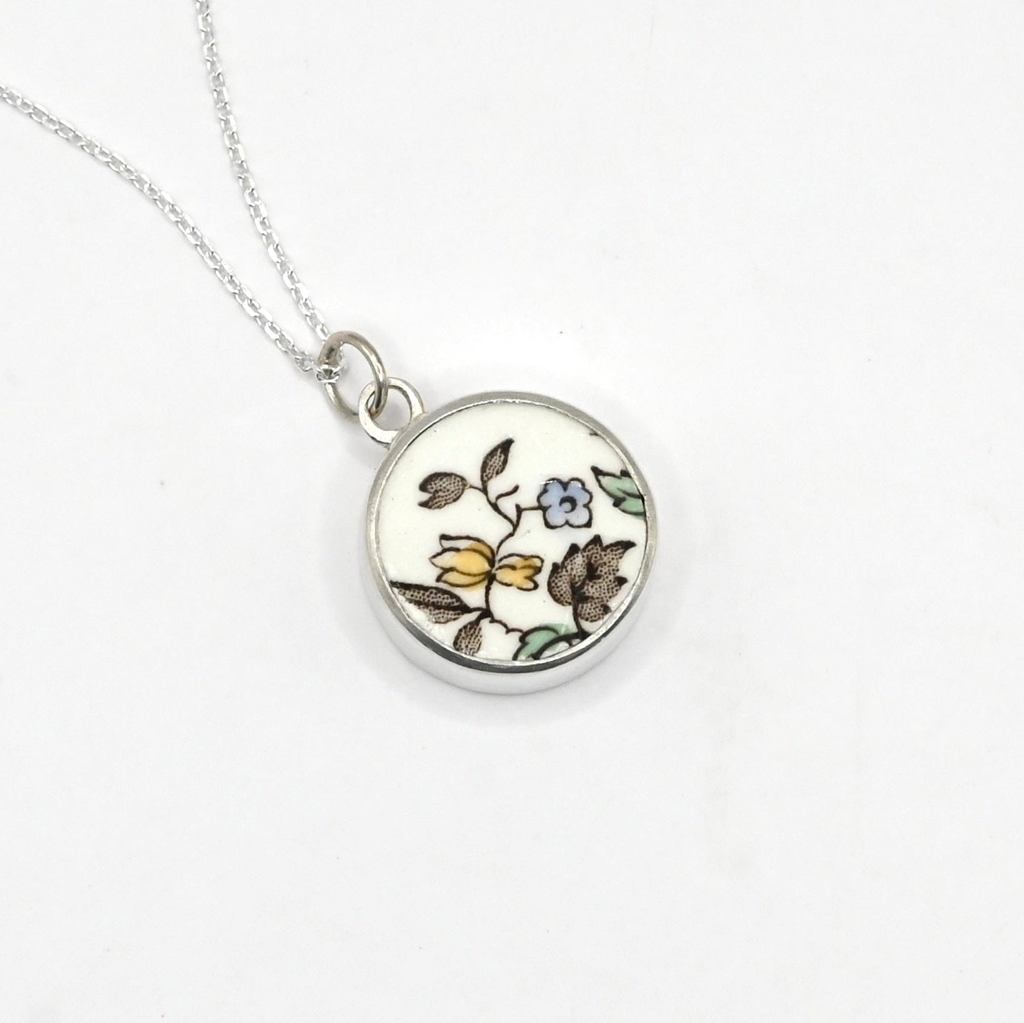 Double Bloom Shard Pendant - front face delicate blue and yellow floral antique china in sterling silver bezel