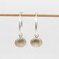 Scallop Shell Hoop Earrings - brass charm hanging display, sterling silver hoop earrings by Natasha Wood