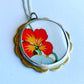 Orange Nasturtium Ceramic Pendant - front view, silver bezel and scalloped brass border