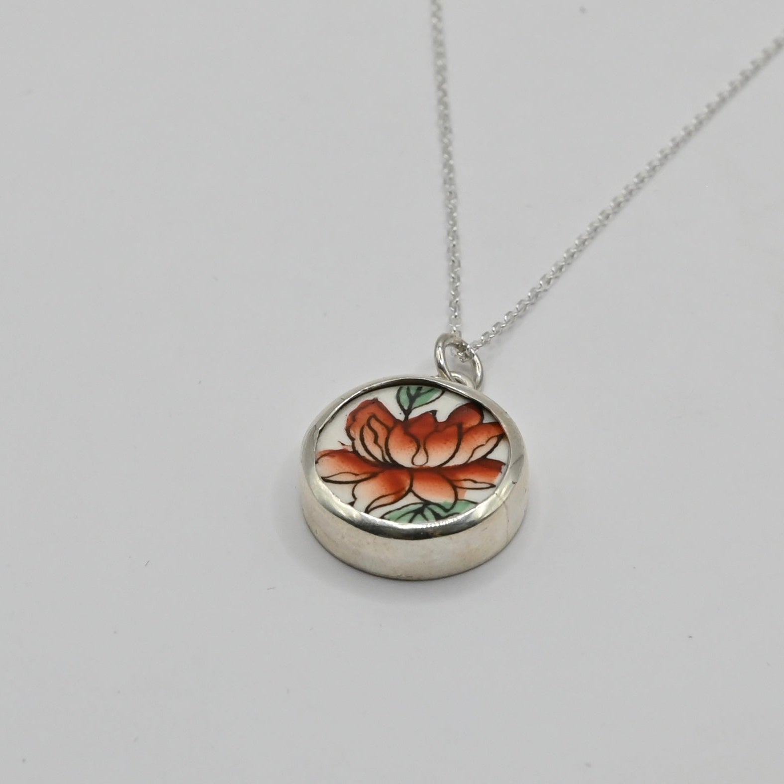showing back of the pendant with a small heart cut out detail - Natasha Wood Jewellery