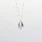 Silver shell pendant necklace on a white background