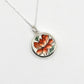 Golden Lotus Bloom pendant - side angle showing sterling silver bezel depth and ceramic inlay with chain