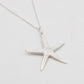 Silver starfish pendant on a white background