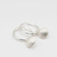 Silver Scallop Shell Hoop Earrings - sterling silver charm close-up flat lay