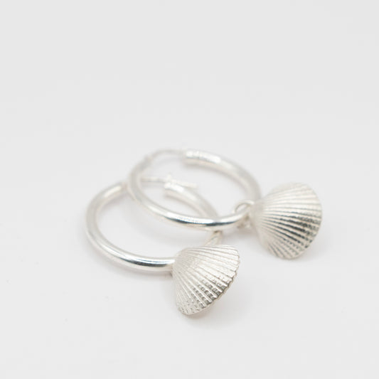 Silver hoops with scallop shell charm