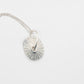 Santa Maria Shell Pendant - flat-lay diagonal view, sterling silver limpet shell and chain