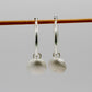Silver Scallop Shell Charm Hoop Earrings - close-up of shell charm texture, sterling silver