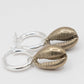 Cowry Shell Hoop Earrings - close-up portrait brass cowry charm detail on silver hoop