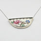 Necklace with a floral pendant on a white background