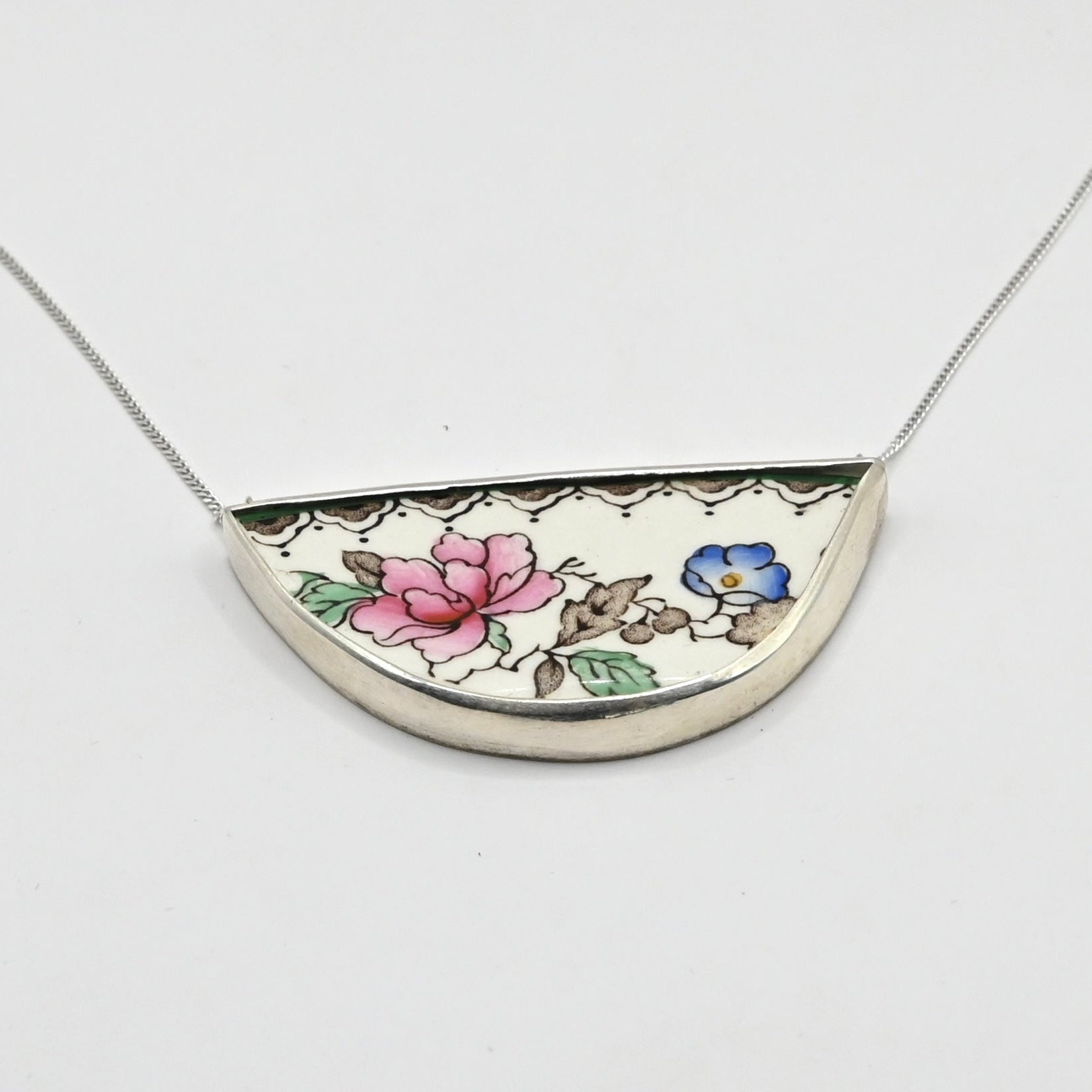 Necklace with a floral pendant on a white background