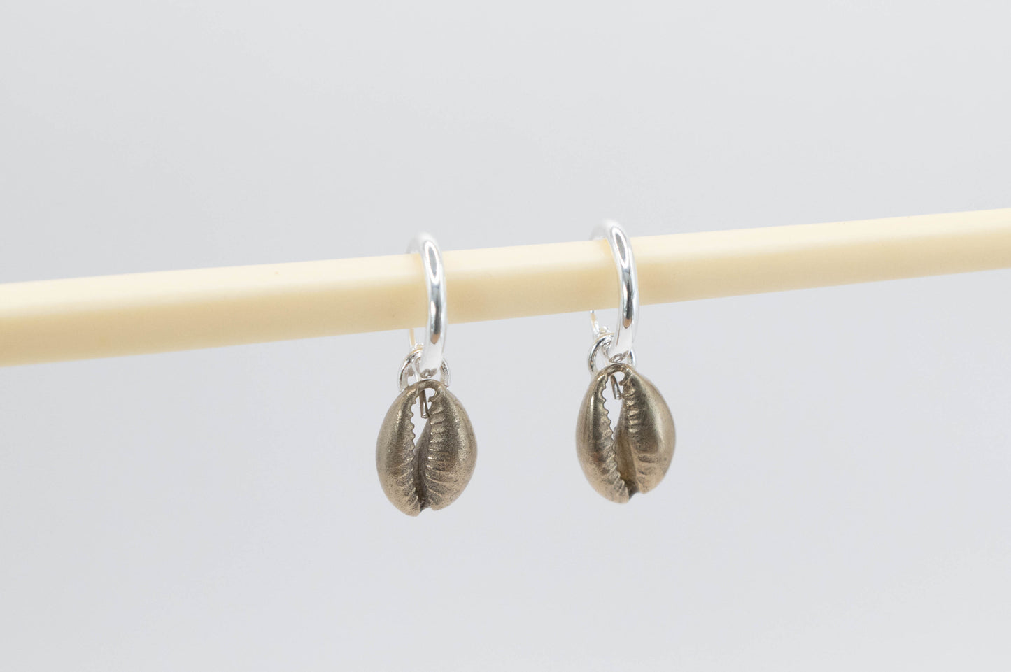 Cowry shells on silver hoops