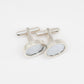 Golf Ball Cufflinks - flat-lay overhead view showing pair, sterling silver with golf ball dimple inlay