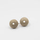 Medium Urchin Hook Earrings in brass - macro close-up on white showing sea urchin surface texture and pore detail