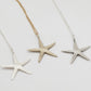 Starfish Pendant Necklace - sterling silver, oxidised silver and brass variants on white background