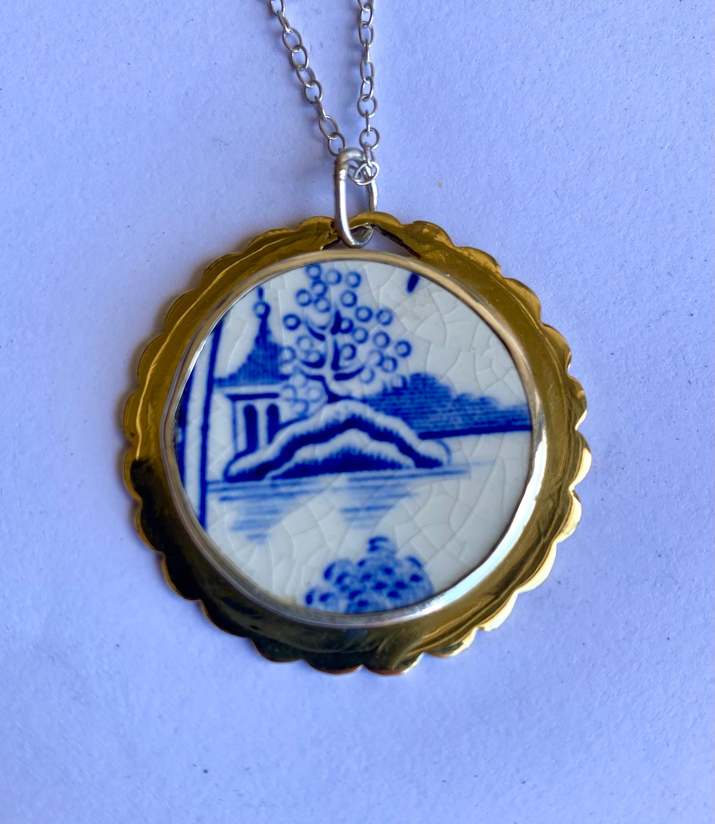 Blue and white Porcelain, silver and brass pendant