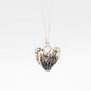 Protea Heart Pendant – hanging front view – oxidised sterling silver on curb chain