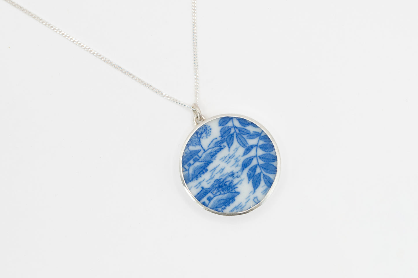 Light Blue & white antique ceramic Willow pattern and silver pendant