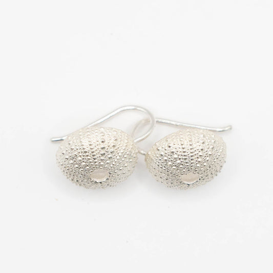 Medium Urchin Hook Earrings in sterling silver - flat lay on white, showing soldered silver hook detail