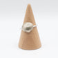 Silver Scallop Shell Ring - outdoor lifestyle shot on coastal rock
