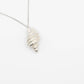 Tulip Conch Necklace - sterling silver pendant side angle on white background curb chain