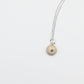 Small Sea Urchin Necklace - natural-finish sea urchin pendant on sterling silver chain, angled studio shot