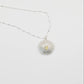 Sterling Silver Sea Urchin Pendant with Blue Topaz - side profile on white background showing dome texture